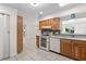 Spacious kitchen with oak cabinets, skylight, modern appliances, and tile flooring at 2623 Parsley Dr, Orlando, FL 32837