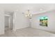 A spacious living room has natural light and tile floors at 2623 Parsley Dr, Orlando, FL 32837