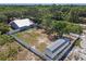 Expansive fenced backyard with a storage shed, offering privacy and room for outdoor activities at 2651 Sunrise Blvd, Mount Dora, FL 32757