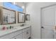 Bright bathroom featuring double vanity, ample counter space, and modern fixtures at 2651 Sunrise Blvd, Mount Dora, FL 32757