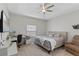 Serene bedroom with soft lighting, comfortable bed, and dedicated workspace for relaxation at 2651 Sunrise Blvd, Mount Dora, FL 32757