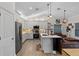 Modern kitchen features stainless steel appliances, white cabinets, and a spacious island at 2651 Sunrise Blvd, Mount Dora, FL 32757