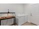 Functional laundry area featuring a washer, dryer, and reptile terrarium at 2651 Sunrise Blvd, Mount Dora, FL 32757