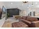 Open-concept living area with a modern kitchen, comfortable seating, and stylish decor at 2651 Sunrise Blvd, Mount Dora, FL 32757