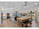 Open-concept layout showcases the kitchen and dining area with a blend of modern finishes at 2651 Sunrise Blvd, Mount Dora, FL 32757