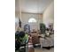 Bright living room with high ceilings, elegant chandelier, and decorative furnishings at 301 Blue Bayou Dr, Kissimmee, FL 34743