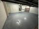 Unfinished basement with painted floor, white walls, and exposed ceiling at 3020 Zaharias Dr, Orlando, FL 32837