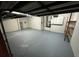 Spacious unfinished basement featuring painted floor, white walls, and shelving at 3020 Zaharias Dr, Orlando, FL 32837