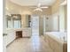 Spacious bathroom with a walk-in shower, soaking tub, and double vanity at 3020 Zaharias Dr, Orlando, FL 32837