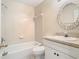 Bathroom featuring a tiled shower-tub, a toilet, and vanity at 3020 Zaharias Dr, Orlando, FL 32837