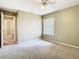 Bedroom featuring neutral walls, carpet flooring, and an adjoining doorway at 3020 Zaharias Dr, Orlando, FL 32837