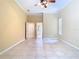 Large bedroom featuring neutral walls, tile floors, and a ceiling fan at 3020 Zaharias Dr, Orlando, FL 32837