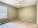 Well-lit bedroom with neutral walls, a ceiling fan, and a window with blinds at 3020 Zaharias Dr, Orlando, FL 32837