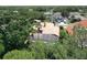Aerial view of home showcasing the tile roof and screened pool at 3020 Zaharias Dr, Orlando, FL 32837
