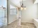 Hallway featuring neutral walls, tiled floors, and a bright and airy atmosphere with ample natural light at 3020 Zaharias Dr, Orlando, FL 32837