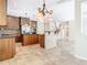 Spacious kitchen featuring dark wood cabinets, stainless steel appliances, and an island with a stone accent wall at 3020 Zaharias Dr, Orlando, FL 32837