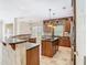 Spacious kitchen featuring granite countertops, an island cooktop, stainless steel appliances, and pendant lighting at 3020 Zaharias Dr, Orlando, FL 32837