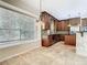 Bright kitchen with wood cabinets, stainless steel appliances, and large windows offering plenty of natural light at 3020 Zaharias Dr, Orlando, FL 32837