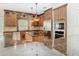 Modern kitchen featuring stainless steel appliances, granite countertops, custom cabinetry, and a center island at 3020 Zaharias Dr, Orlando, FL 32837