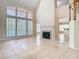 Living room with fireplace, tall ceilings, and lots of natural light and view of the swimming pool at 3020 Zaharias Dr, Orlando, FL 32837