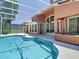 Relaxing screened-in pool and hot tub area with ample space for entertaining at 3020 Zaharias Dr, Orlando, FL 32837