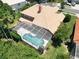 Aerial view of a screened-in pool area, perfect for outdoor relaxation and entertaining in private at 3020 Zaharias Dr, Orlando, FL 32837