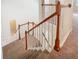 Carpeted staircase with white railings leading to the upper level of the house at 3020 Zaharias Dr, Orlando, FL 32837