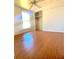 Bedroom with hardwood floors, closet, and window at 311 E Bridgers Ave, Auburndale, FL 33823