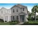 Charming two-story home with a landscaped yard and inviting blue front door at 3189 Douglas Fir Dr, Apopka, FL 32703