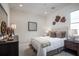Cozy bedroom with modern decor, comfortable bed, and a warm, inviting ambiance at 3289 Songbird Cir, Harmony, FL 34773