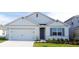 Charming single-story home with a two car garage, landscaped front yard, and a welcoming entrance at 33455 Copper Hill Way, Sorrento, FL 32776