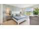 Calming bedroom with a large bed, stylish furniture, and a view overlooking the outside scenery at 33640 Seattle Slew Dr, Sorrento, FL 32776