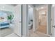 Bright hallway view to Primary bedroom, bathroom and walk-in closet at 33640 Seattle Slew Dr, Sorrento, FL 32776
