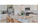 Well-lit kitchen boasting a central island with seating and modern stainless steel appliances at 33640 Seattle Slew Dr, Sorrento, FL 32776