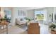 Cozy living room featuring a comfortable sofa, bright window, and neutral decor at 33640 Seattle Slew Dr, Sorrento, FL 32776