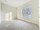 Bright bedroom featuring tile floors and a large window at 341 Bahia Cir, Longwood, FL 32750
