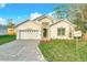 Charming single-story home with a well-manicured front yard and a brick driveway at 341 Bahia Cir, Longwood, FL 32750