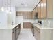 Kitchen featuring an island, stainless appliances and a gray tile backsplash at 341 Bahia Cir, Longwood, FL 32750