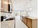 Modern kitchen with island, stainless steel appliances, and an open concept layout at 341 Bahia Cir, Longwood, FL 32750
