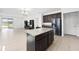 Open kitchen offers a granite island, stainless steel appliances and adjoins the living area at 3753 Apopka Ridge Cir, Apopka, FL 32703