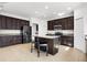 Kitchen features a center island, granite countertops, stainless steel appliances, and tiled flooring at 3753 Apopka Ridge Cir, Apopka, FL 32703
