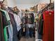Walk-in closet with metal shelving, many personal items, and carpet flooring at 3753 Apopka Ridge Cir, Apopka, FL 32703
