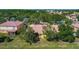 Aerial view showcases the property's mature trees and manicured landscaping at 3908 Coastal Breeze Dr, Kissimmee, FL 34744