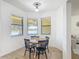 Cozy breakfast nook with lake views, bright natural light, and casual dining at 3908 Coastal Breeze Dr, Kissimmee, FL 34744