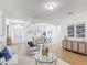 Open-concept living space with tile floors, neutral decor, and easy access to the dining area at 3908 Coastal Breeze Dr, Kissimmee, FL 34744