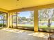 Screened-in porch overlooking the lake, offering serene views and outdoor relaxation at 3908 Coastal Breeze Dr, Kissimmee, FL 34744