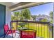 Balcony with two chairs overlooking the grassy area and building at 4117 S Semoran Blvd # 17, Orlando, FL 32822