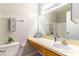 Bathroom featuring a sink and vanity with framed mirror and plants at 4117 S Semoran Blvd # 17, Orlando, FL 32822