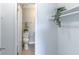 A half bathroom with a plant sitting atop the toilet tank at 4117 S Semoran Blvd # 17, Orlando, FL 32822