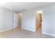 Neutral bedroom with tile flooring and en suite bathroom access at 4117 S Semoran Blvd # 17, Orlando, FL 32822